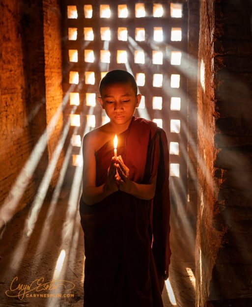 Caryn-Esplin_monk-candles-temple-myanmar